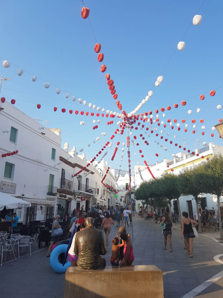 Party atmosphere in the old town of Conil during the September fair